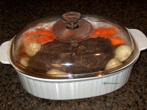 Cooking a Roast with Potatoes and Carrots in the Oven